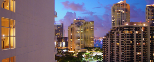 Miami home & condo sales boomed last month thanks to tax laws, realtors association says.